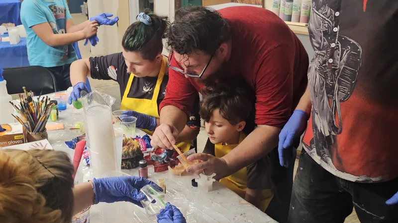 Families making things together at the studio tables