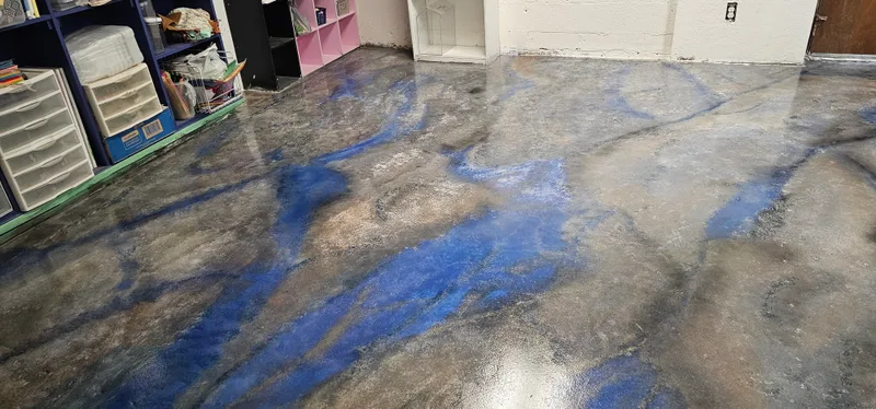 A poured epoxy floor in deep blue and white