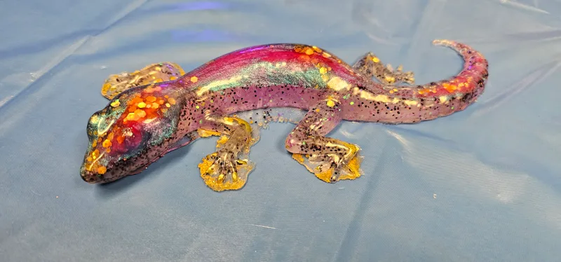 A resin lizard finished in glitter and colour