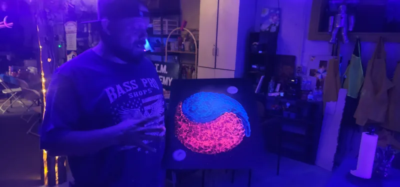 A canvas glowing under ultraviolet light