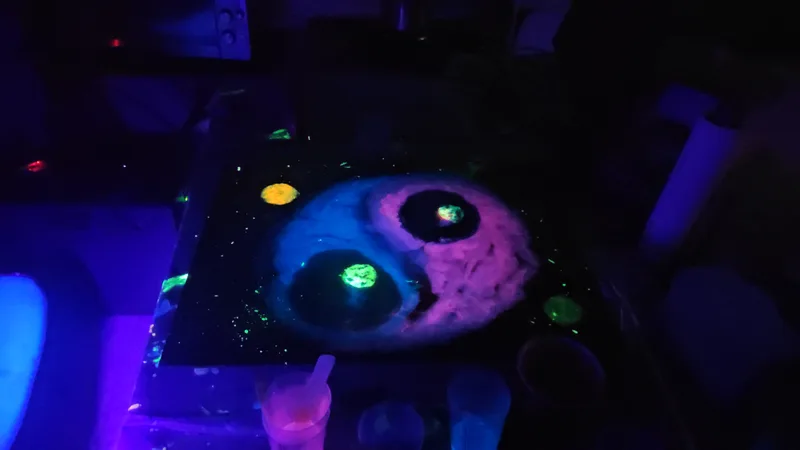 Blacklight-reactive artwork under ultraviolet light