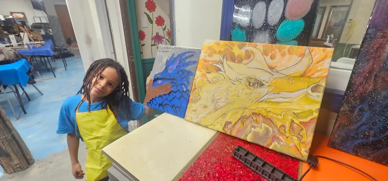 A young maker with a plaster piece in the studio