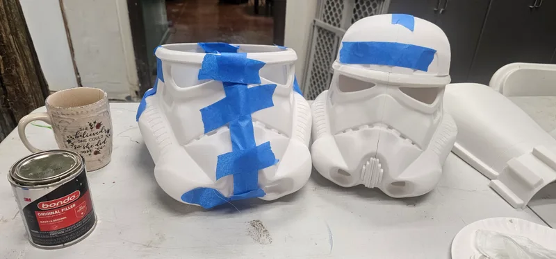 Cast plaster helmets waiting to be painted